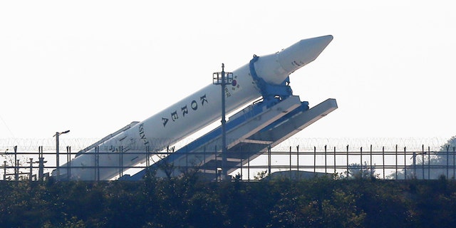 Oct. 26, 2012: The Korea Space Launch Vehicle-1 (KSLV-1) is lowered from a launch pad for checking at the Naro Space Center in Goheung, South Korea. South Korea has been forced to postpone its third attempt to launch a satellite into space from its own soil because of a last-minute technical glitch.