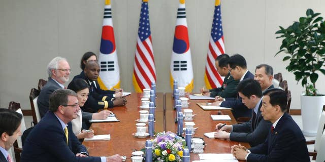 U.S. Defense Secretary Ash Carter, second left, talks with his South Korean counterpart Han Min Koo, right, during their meeting at the Defense Ministry in Seoul Friday, April 10, 2015. (AP Photo/Kim Hong-Ji, Pool)
