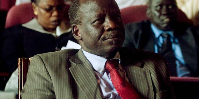 FILE - In this Wednesday, Oct. 13, 2010 file photo, Dr. Lam Akol, head of the Sudan People's Liberation Movement-Democratic Change party, listens during a discussion of southern unity and cooperation, during an all-southern-parties meeting in Juba, in then southern Sudan. South Sudanese opposition leader Lam Akol told The Associated Press Friday, April 24, 2015, that his house in the capital Juba was surrounded overnight by the country's security forces with security operatives closing the two roads leading to it, although they had not forced their way into his property. (AP Photo/Pete Muller, File)