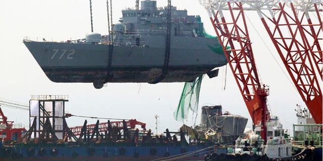 April 24: A giant offshore crane salvages bow section of the sunken South Korean naval ship off Baengnyeong Island, South Korea.