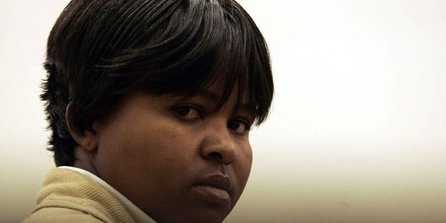 In this July 29, 2008 file photo, South African Tiny Virginia Makopo stands in the dock, at the start of a trial at the Sebokeng Magistrate Court, south of Johannesburg, South Africa.