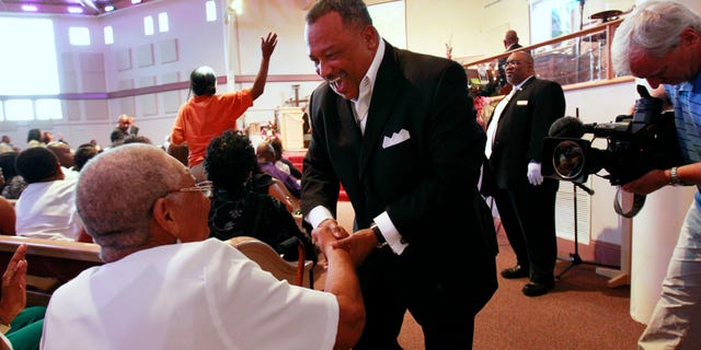 June 3: Reverend Fred Luter, pastor of the Franklin Ave. Baptist Church, greets congregation members during Sunday Services at the Church in New Orleans.