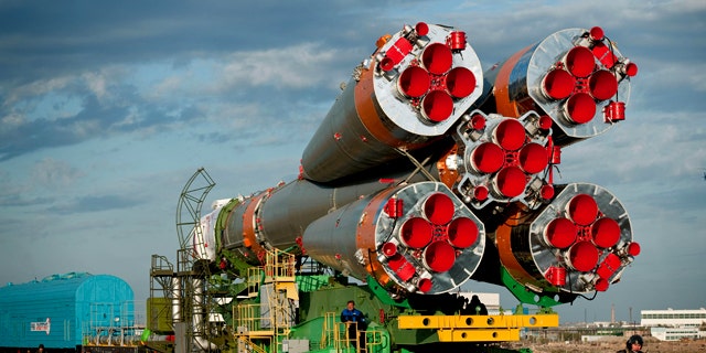 A Soyuz spacecraft is rolled out by train to the launch pad at the Baikonur Cosmodrome, Kazakhstan, on Oct. 5, 2010.