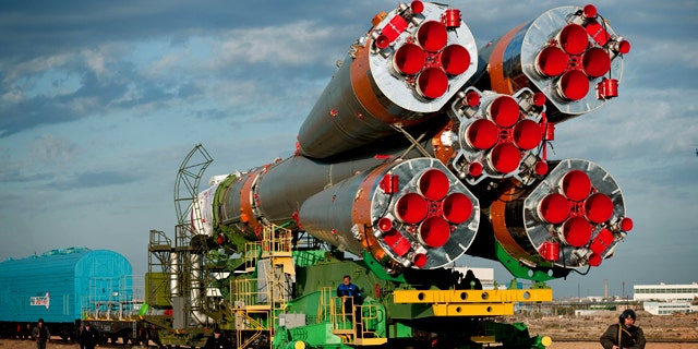 A Soyuz spacecraft is rolled out by train to the launch pad at the Baikonur Cosmodrome, Kazakhstan, on Oct. 5, 2010.