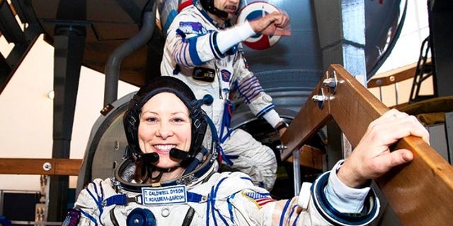 U.S. astronaut Tracy Caldwell Dyson and Russia's Mikhail Kornienko in March at a space center near Moscow.
