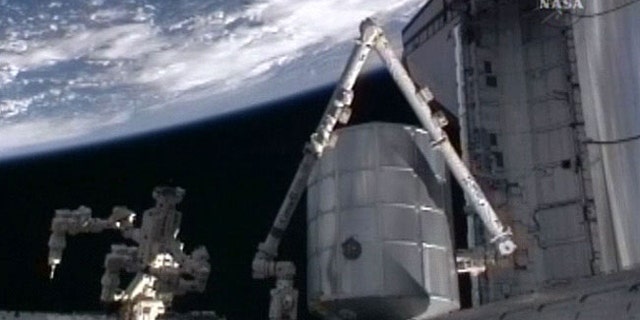 The cargo pod Leonardo, a multi-purpose logistics module for the International Space Station, is attached to the Earth-facing berth of the outpost's Harmony node on April 8, 2010 after being moved from shuttle Discovery's payload bay during the STS-131 mission.