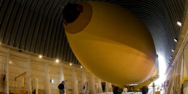 Space shuttle Discovery's external fuel tank, ET-137, is loaded into its Pegasus barge at the Michoud Assembly Facility in New Orleans for shipment to NASA's Kennedy Space Center. The planned 6-day delivery was hampered by a massive oil spill in the Gulf of Mexico, which forced NASA to hire a commercial tug for part of the journey.