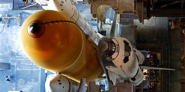 May 31: Space shuttle Atlantis is seen from the 34th floor in the Vehicle Assembly Building before rolling out to Launch Pad 39A at the Kennedy Space Center in Cape Canaveral, Fla. Atlantis will make the final flight ever by a space shuttle in just five weeks to end the 30-year program. It heads to the launch pad Tuesday night for a July 8 liftoff; the three-mile trip from the hangar should be completed by the time Endeavour lands at 2:35 a.m. (AP)