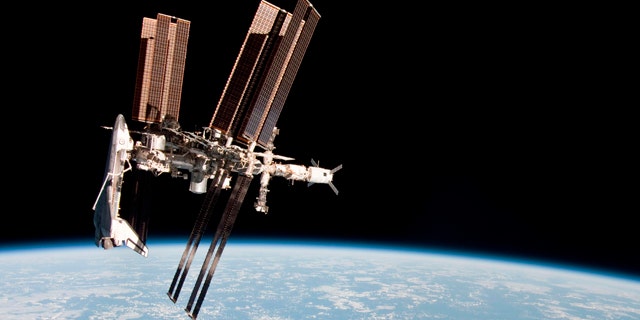 May 23, 2011: The International Space Station and the docked space shuttle Endeavour, left, at an altitude of approximately 220 miles.