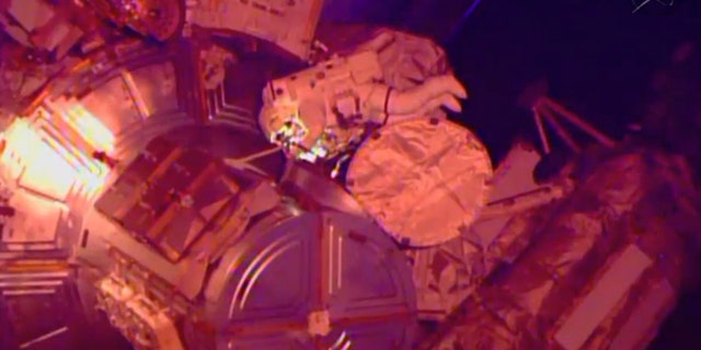 March 1, 2015: In this image from NASA television astronaut Terry Virts exits the Quest airlock hatch beginning the third spacewalk outside the International Space Station. (AP/NASA-TV)