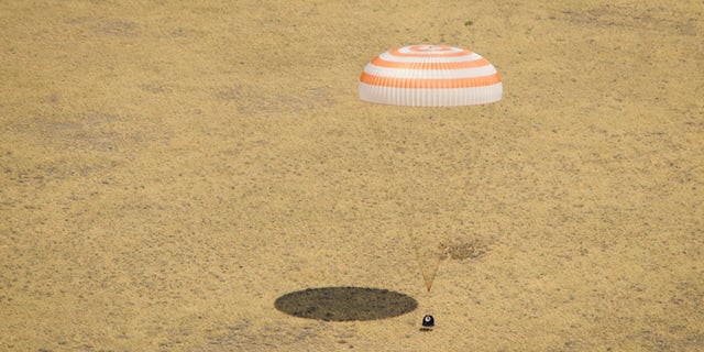 July 1, 2012: The Soyuz TMA-03M spacecraft is seen as it lands with Expedition 31 Commander Oleg Kononenko of Russia and Flight Engineers Don Pettit of NASA and Andre Kuipers of the European Space Agency in a remote area near the town of Zhezkazgan, Kazakhstan.