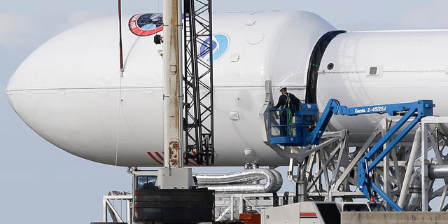 File photo - Maintenance is performed by workers on the Falcon 9 SpaceX rocket at launch complex 40 at the Cape Canaveral Air Force Station in Cape Canaveral, Fla., Monday, Feb. 9, 2015.