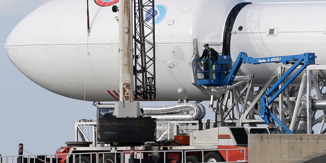 File photo - Maintenance is performed by workers on the Falcon 9 SpaceX rocket at launch complex 40 at the Cape Canaveral Air Force Station in Cape Canaveral, Fla., Monday, Feb. 9, 2015.