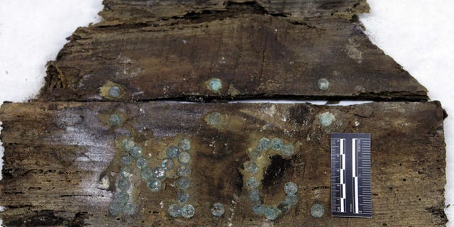 In this photo taken on Saturday, Jan. 24, 2015 and provided by Aranzadi Science Society, the initials "M.C" are seen on a plank of a coffin found on unidentified graves in the chapelâs crypt of the closed order Convent of the Barefoot Trinitarians in Madrid's historic Barrio de las Letras, or Literary Quarter. Experts searching for the remains of Miguel de Cervantes, the author of 'Don Quixote' who was buried in 1616 at the Convent but the exact whereabouts of his grave are unknown, have found a casket bearing the initials âM.C.â with bones inside it in crypt underneath a cloistered convent. Archeologists say they made the find over the weekend after excavations to solve the centuries-old mystery of where the great Spanish writer was laid to rest. (AP Photo/Aranzadi Science Society)