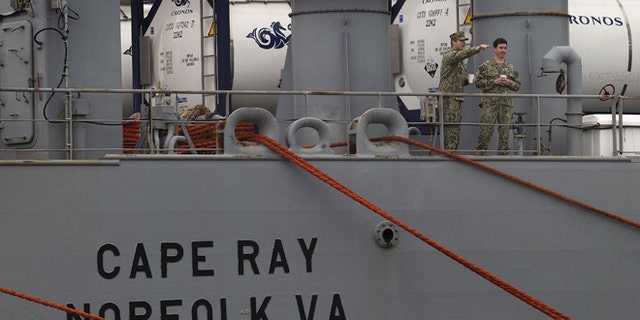 U.S. military personnel stand on the deck of American ship MV Cape Ray as it is docked at Naval Station in Rota, Spain, on Thursday Feb. 13, 2014. The American ship arrived on Thursday at the naval base of Rota on Spains southwestern coast used by the U.S. to resupply ahead of an unprecedented mission to collect and destroy mustard gas, raw materials for sarin nerve gas and tons of other highly toxic chemicals that form part of Syrias chemical weapons program. After leaving Spain, the Cape Rays next port of call is expected to be Gioia Tauro in southern Italy, where experts from the Organization for the Prohibition of Chemical Weapons say it will take on board 560 metric tons of chemicals that have been transported from the Syrian port of Latakia in two cargo ships from Denmark and Norway. (AP Photo/Miguel Angel Morenatti)