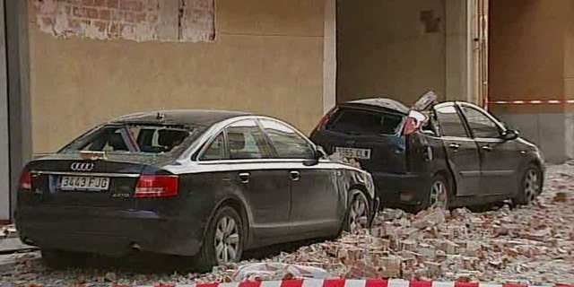 May 11: Damaged vehicles and debris are seen on the street after an earthquake in Lorca Spain in this image taken from TV. Two earthquakes struck southeast Spain in quick succession Wednesday, killing several people, and injuring dozens and causing major damage to buildings, officials said. The epicenter of the quakes with magnitudes of 4.4 and 5.2 was close to the town of Lorca, and the second came about two hours after the first. (AP)