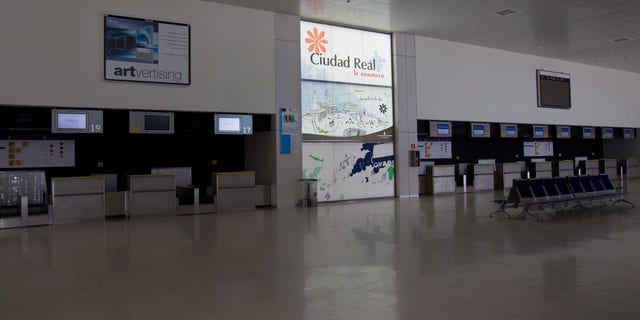 Check-in desks stand empty at the Central airport in Ciudad Real, Spain.