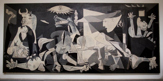 This  Tuesday Feb. 21, 2012 photo of Pablo Picasso's "Guernica" painting is seen displayed at the Reina Sofia Museum in Madrid. (AP Photo/Paul White)