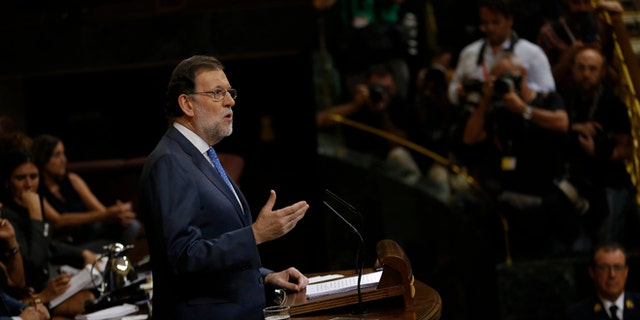 Spain's acting Prime Minister and Popular Party leader Mariano Rajoy addresses lawmakers during the first of the two-day investiture debate at the Spanish parliament in Madrid, Tuesday, Aug. 30, 2016. Rajoy is to start a two-day parliamentary debate later Tuesday ahead of a vote on his bid to form a minority government and end an eight-month political impasse, but the signs are he won't be successful. (AP Photo/Francisco Seco)