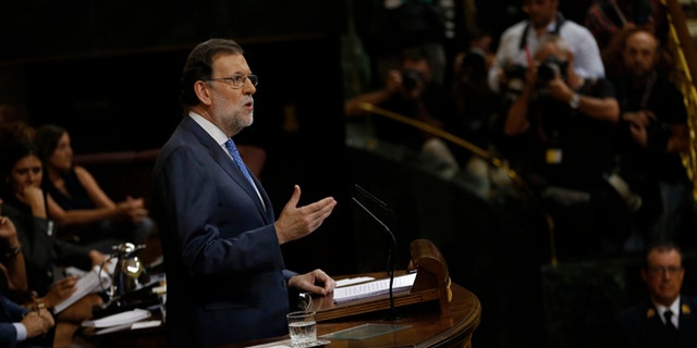 Spain's acting Prime Minister and Popular Party leader Mariano Rajoy addresses lawmakers during the first of the two-day investiture debate at the Spanish parliament in Madrid, Tuesday, Aug. 30, 2016. Rajoy is to start a two-day parliamentary debate later Tuesday ahead of a vote on his bid to form a minority government and end an eight-month political impasse, but the signs are he won't be successful. (AP Photo/Francisco Seco)