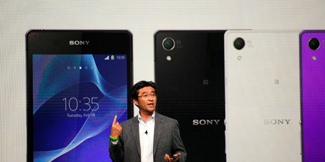 President and CEO of Sony Mobile Communications Kunimasa Suzuki presents the Smartphone Xperia Z2 during the Mobile World Congress, the world's largest mobile phone trade show in Barcelona, Spain, Monday, Feb. 24, 2014.