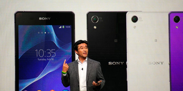 President and CEO of Sony Mobile Communications Kunimasa Suzuki presents the Smartphone Xperia Z2 during the Mobile World Congress, the world's largest mobile phone trade show in Barcelona, Spain, Monday, Feb. 24, 2014.