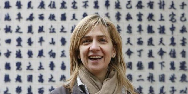 Spain's Princess Infanta Cristina smiles during a visit to a temple in Vietnam in 2009 (Reuters)