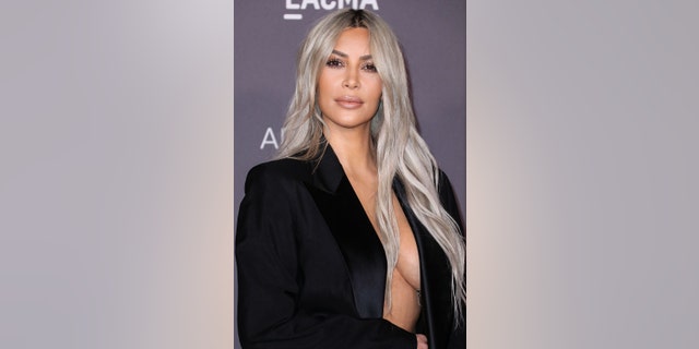 Kim Kardashian sparked outrage online by posting a topless photo taken by her four-year-old daughter.
