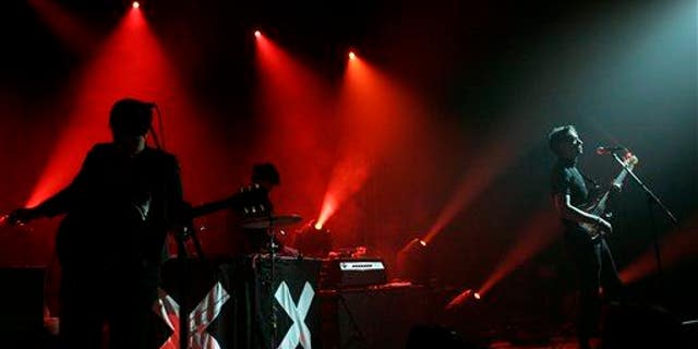 Romy Madley Croft, left, Oliver Sim, center, and Jamie Smith of the band The xx perform at the Bonnaroo Music and Arts Festival in Manchester, Tenn., June 10, 2010.