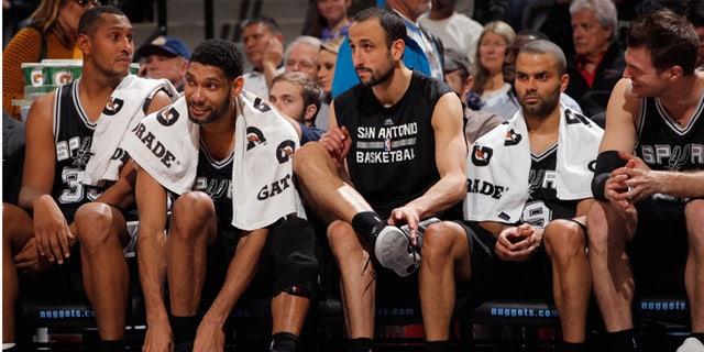 DENVER, CO - JANUARY 20: (L-R) Boris Diaw #33, Tim Duncan #21, Manu Ginobili #20, Tony Parker #9 and Tiago Splitter #22 of the San Antonio Spurs sit on the bench late in the game against the Denver Nuggets at Pepsi Center on January 20, 2015 in Denver, Colorado. The Spurs defeated the Nuggets 109-99. NOTE TO USER: User expressly acknowledges and agrees that, by downloading and or using this photograph, User is consenting to the terms and conditions of the Getty Images License Agreement. (Photo by Doug Pensinger/Getty Images)