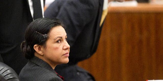 Ana Lilia Trujillo, left, sits in the courtroom before opening arguments in her trial, Monday, March 31, 2014, in Houston. Trujillo, 45, is charged with murder, accused of killing her 59-year-old boyfriend, Alf Stefan Andersson, at his Museum District high-rise condominium in June 2013. (AP Photo/Houston Chronicle, Brett Coomer)