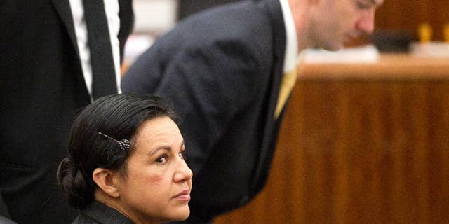 Ana Lilia Trujillo, left, sits in the courtroom before opening arguments in her trial, Monday, March 31, 2014, in Houston. Trujillo, 45, is charged with murder, accused of killing her 59-year-old boyfriend, Alf Stefan Andersson, at his Museum District high-rise condominium in June 2013. (AP Photo/Houston Chronicle, Brett Coomer)