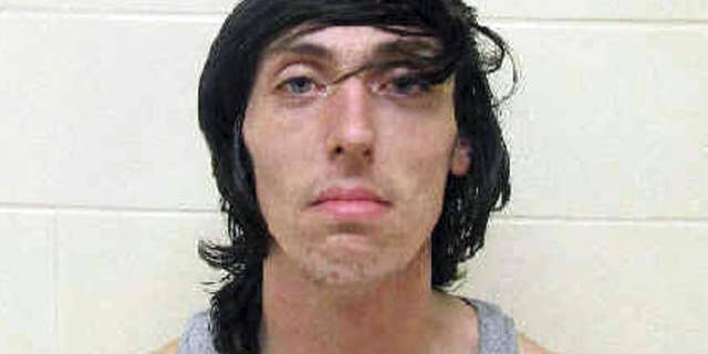 This booking photo released Monday, Aug. 24, 2015, by the Scioto County Jail in Portsmouth, Ohio, shows Kevin Blakemore, 21, arrested Sunday, Aug. 23, 2015, in Pike County, Ohio, on escape and theft charges. Massachusetts authorities said Blakemore began a crime spree on in Boxborough, Mass., Thursday when Massachusetts authorities say he allegedly stabbed a relative a male relative, assaulted a woman, and forced both into a car that he drove to Ohio. (Scioto County Jail via AP)