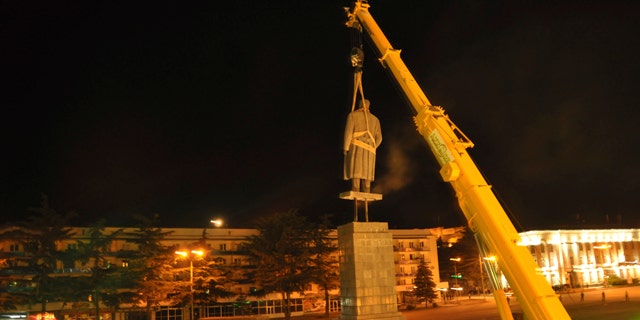 June 25: In this photo released by Gori region administration a statue of Soviet dictator Josef Stalin is dismantled at his home town of Gori, 80 kms (50 miles) west of the Georgian capital Tbilisi. Authorities in Georgia have torn down a monument to Soviet dictator Josef Stalin in his birthplace of Gori to make way for a memorial to the fallen in the Russian-Georgian war of 2008. (AP)