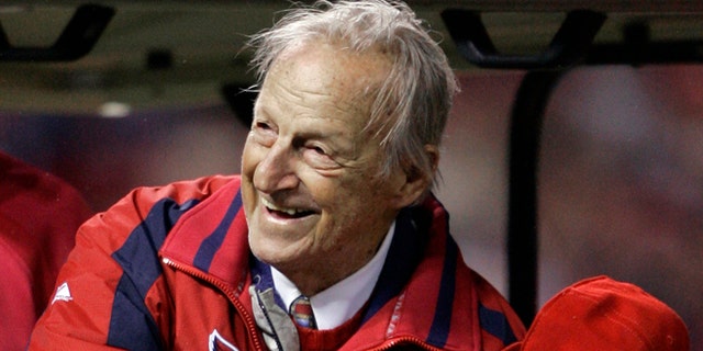 Oct. 27, 2006: In this file photo, Hall of Famer Stan Musial gets ready to throw out the ceremonial first pitch before Game 5 of the World Series between the St. Louis Cardinals and Detroit Tigers in St. Louis.