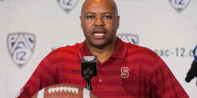 FILE - In this July 24, 2014, file photo, Stanford head coach David Shaw takes questions at the 2014 Pac-12 NCAA college football media days in Los Angeles. Nobody might have been happier when the Pac-12’s preseason media poll picked Oregon to win the North Division than Stanford coach Shaw and his players. (AP Photo/Damian Dovarganes, File)
