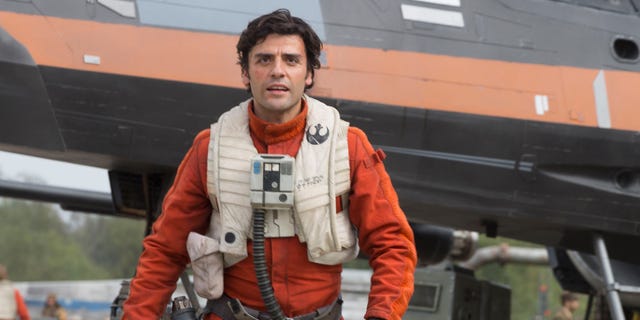 This photo provided by Disney/Lucasfilm shows Oscar Isaac as Poe Dameron in a scene from "Star Wars: The Force Awakens," directed by J. J. Abrams. The new film releases in U.S. theaters on Dec. 18, 2015. (David James/Disney/Lucasfilm via AP)