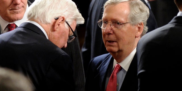 Senate Minority Leader Mitch McConnell of Ky. arrives for President Barack Obama's State of the Union address on Capitol Hill in Washington, Tuesday Jan. 28, 2014. (AP Photo/Susan Walsh)