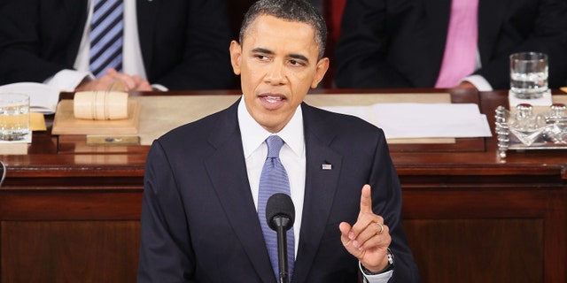 FILE U.S. President Barack Obama, flanked by Vice President Joe Biden (L) and Speaker of the House John Boehner (R-OH), addresses a Joint Session of Congress while delivering his State of the Union speech January 25, 2011 in Washington, DC. During his speech Obama was expected to focus on the U.S. economy and increasing education and infrastructure funding while proposing a three-year partial freeze of domestic programs and $78 billion in military spending cuts. (Photo by Alex Wong/Getty Images) *** Local Caption ***
