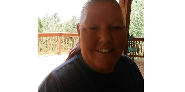 Stayc LaFern, a victim of "caller ID spoofing," is pictured here outside her Colorado Springs two truck business.