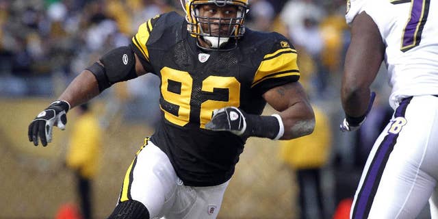 FILE - In this Dec. 27, 2009, file photo, Pittsburgh Steelers linebacker James Harrison (92) rushes against the Baltimore Ravens during an NFL football game in Pittsburgh. Harrison is itching to get back to work. The commute could be an easy one. The five-time Pro Bowl linebacker posted a thinly veiled message via Instagram on Monday night that hinted at an imminent return to the Pittsburgh Steelers. (AP Photo/Keith Srakocic, File)