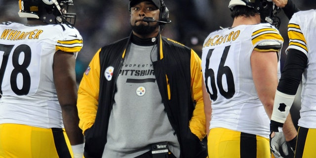 Nov. 28, 2013: In this file photo, Pittsburgh Steelers coach Mike Tomlin stands on the sideline during an official play review in the second half of an NFL football game against the Baltimore Ravens, in Baltimore.