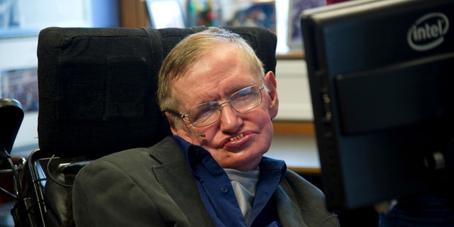 British physicist Stephen Hawking sits at his desk in the Applied Mathematics Department of Cambridge University August 30, 2012. (REUTERS/Guillermo Granja/Vice Presidency of Ecuador/Handout)