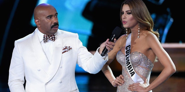 Steve Harvey listens as Miss Colombia answers a question during the 2015 Miss Universe Pageant on Dec. 20, 2015.