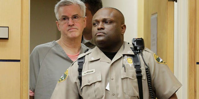 April 23: Steve Powell is led into in a Pierce County Superior Court hearing in Tacoma, Wash.
