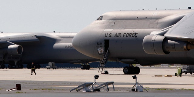 U.S. Air National Guard C-5 jets sit on the tarmac at Stewart Air National Guard Base in Newburgh, New York, May 21, 2009. The FBI and New York police arrested four Muslim men in Newburgh on Wednesday night after they planted what they believed to be explosives in two cars -- one parked outside each synagogue -- and planned to head to Stewart Air base with what they thought was an activated stinger surface-to-air missile.  REUTERS/Mike Segar  (UNITED STATES CRIME LAW MILITARY RELIGION TRANSPORT)