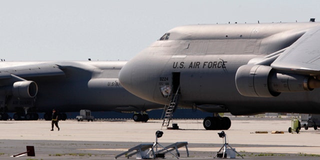 U.S. Air National Guard C-5 jets sit on the tarmac at Stewart Air National Guard Base in Newburgh, New York, May 21, 2009. The FBI and New York police arrested four Muslim men in Newburgh on Wednesday night after they planted what they believed to be explosives in two cars -- one parked outside each synagogue -- and planned to head to Stewart Air base with what they thought was an activated stinger surface-to-air missile. REUTERS/Mike Segar (UNITED STATES CRIME LAW MILITARY RELIGION TRANSPORT)