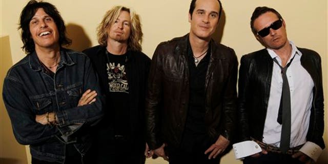 This April 30, 2010 file photo shows the Stone Temple Pilots, from left, Dean Deleo, Eric Kretz, Robert Deleo, and Scott Weiland from the band Stone Temple Pilots, pose for a portrait in Santa Monica, Calif.