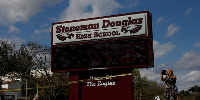 Two Marjory Stoneman Douglas students were arrested for knives, another student made online threats and a Broward County sheriff's deputy was suspended Tuesday.