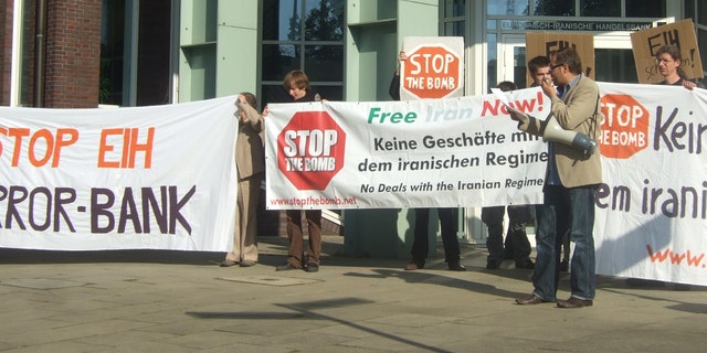 The activist group Stop the Bomb protests EIH 'terror bank.'